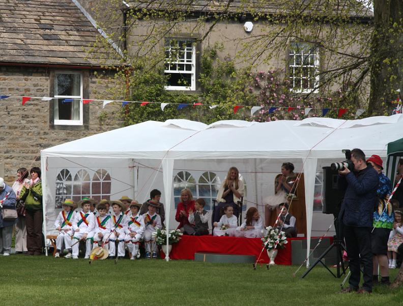May Queens 2.jpg - The May Queen and Morris Dancers watch the Maypole Dancing on the Maypole Green